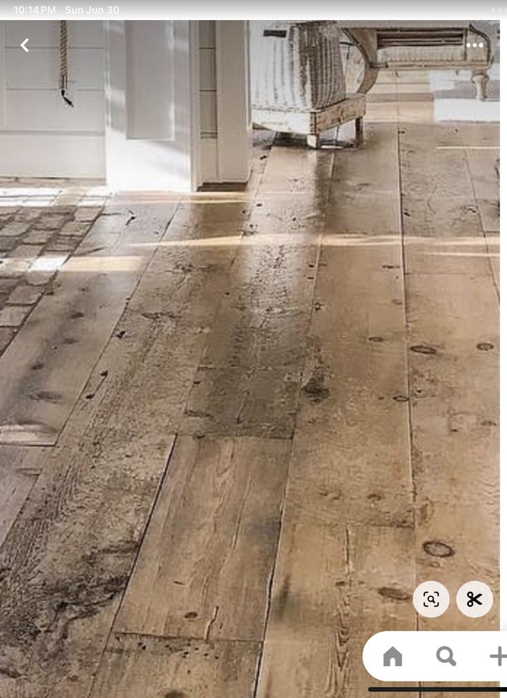 an old wooden floor is being used as a photo framer for the camera's reflection