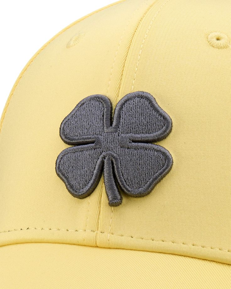 The original. The classic. A hat for every occasion. The Premium Clover 124 is created with the highest levels of craftsmanship for a superior comfort, fit, style and look; featuring performance wick to keep you dry and cool, a premium stretch headband for the best fit possible, and the iconic clover design that you know so well. 100% Players Performance Wick Sweat Band Lining Premium Stretch Fit Low Profile, Structured Cap Jessamine Yellow Hat 3D Charcoal Clover S/M, L/XL Sports Hats With Short Brim, Short Brim Sports Hat, Sporty Baseball Cap With Short Brim, Adjustable Breathable Golf Hat, Sporty Fitted Hats For Sports, Breathable Curved Brim Golf Hat, Sporty Baseball Cap With Short Brim For Sports, Sporty Short Brim Baseball Cap, Breathable Hats For Golf