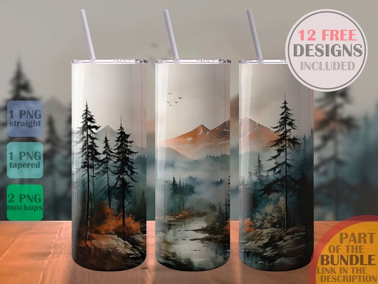 three tumbles with mountains and trees painted on them, sitting on a wooden table