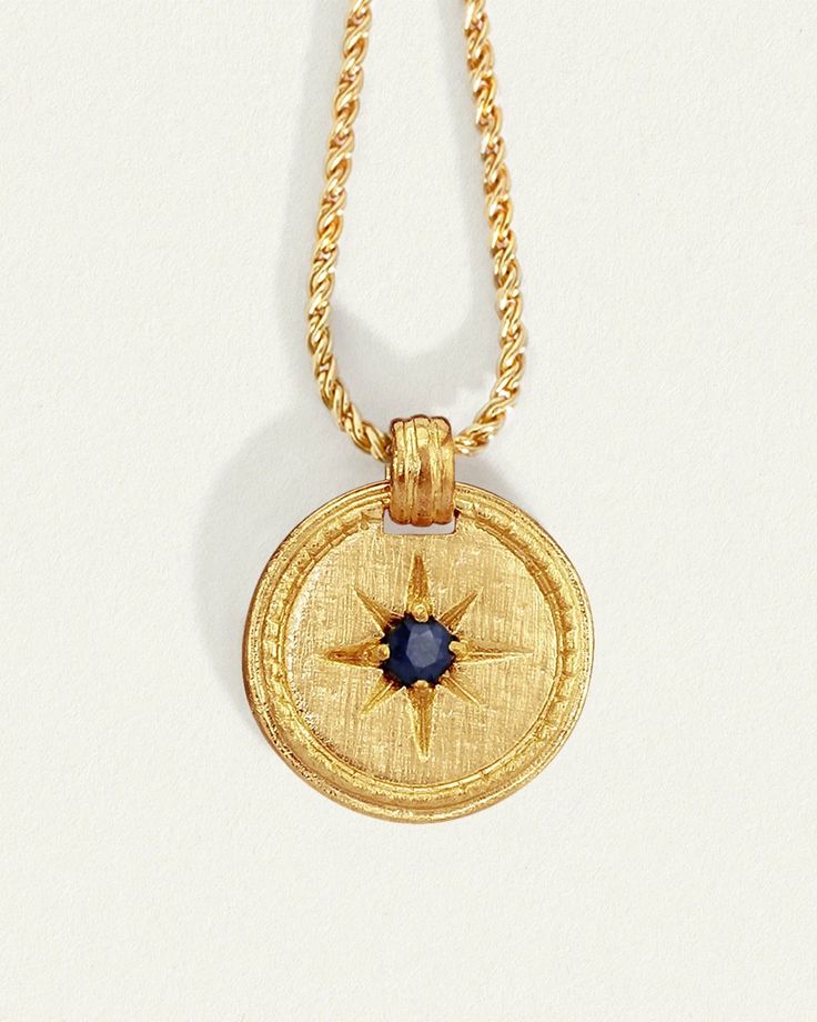 Shop our Stella Necklace Gold in 18k Gold Vermeil A golden cross-brushed circular pendant on a fine rope chain with a natural sapphire stone. Stella Necklace, Egyptian Inspired Jewelry, Golden Cross, Byron Bay Australia, Gold Vermeil Jewelry, Coin Pendant Necklace, Wax Casting, Vermeil Jewelry, Coin Jewelry