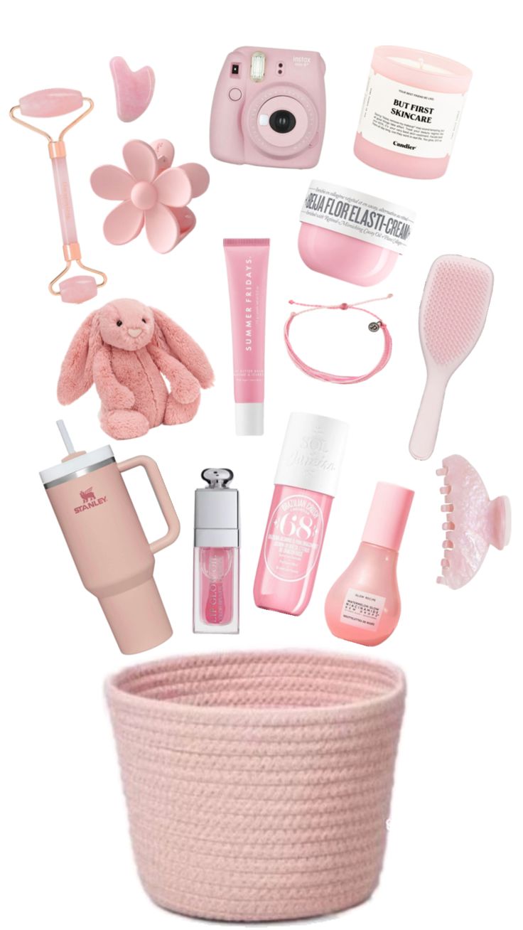 a pink basket filled with lots of different items and things to put on top of it