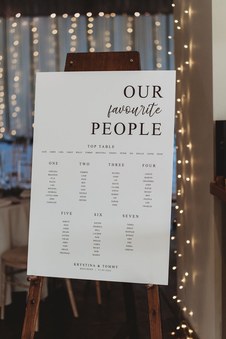 a sign that says our favorite people on it in front of a table with lights