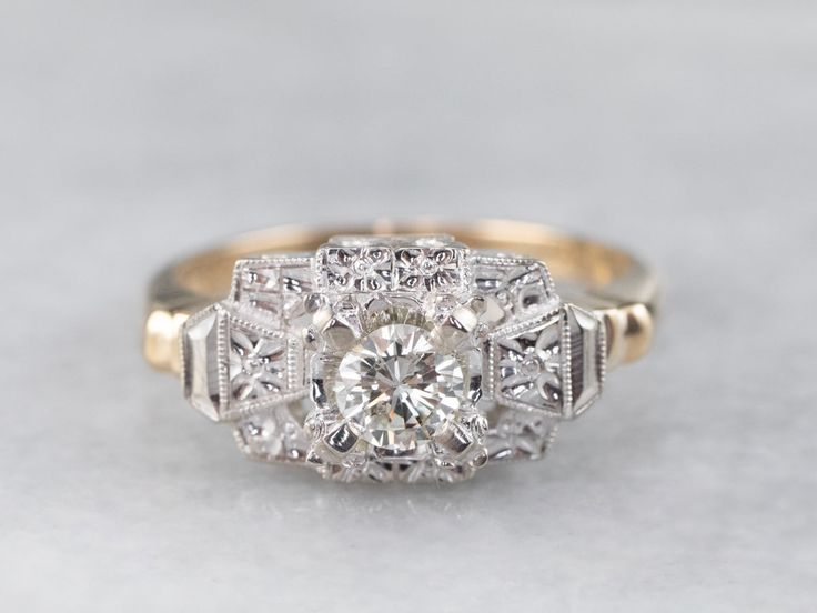 This fabulous vintage ring will serve well for day or night, as an engagement, cocktail ring, or a fantastic right-hand piece! This dates to the Retro era period, and it features stylized floral and geometric lines indicative of the era. Crafted of 14 karat yellow and white gold the better to accent the stunning diamond centerpiece, this ring is comfortable on the hand and easy to wear for any occasion! Metal: 14K Yellow and White Gold Gem: Diamond .28 Carats, SI2 in Clarity, K in Color Gem Measurements: 4.2 mm, Round Ring Size: 6.50 Marks: “14K” Stamped on the inside band Diamond Centerpiece, Diamond Ring Vintage, Vintage Diamond Ring, Sapphire Solitaire Ring, Retro Era, Three Stone Diamond, Vintage Diamond Rings, Purple Sapphire, Gold Diamond Ring