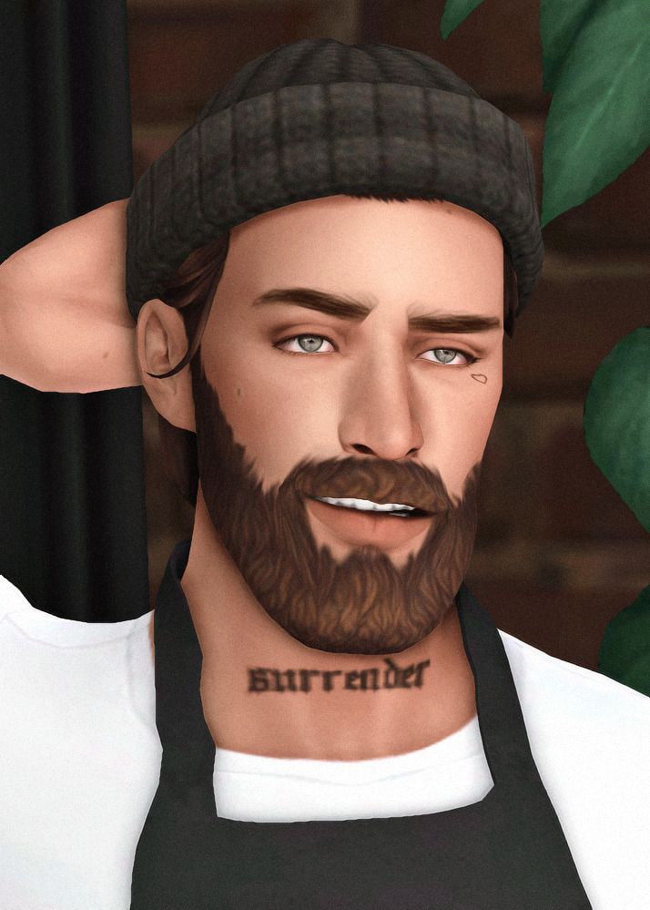 a man with a beard and hat has tattoos on his face as he stands in front of a plant