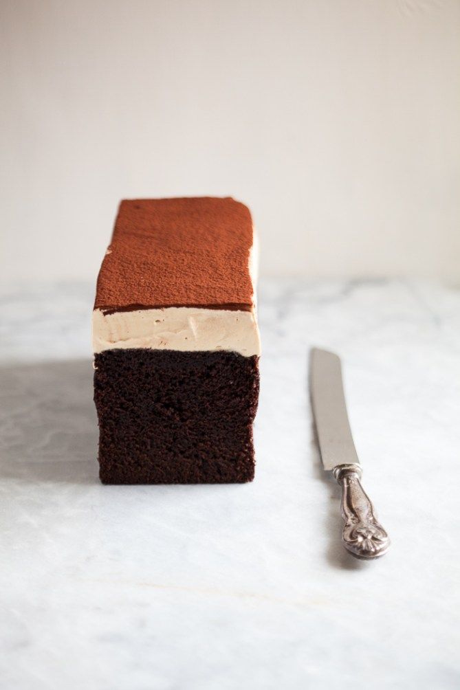 a piece of cake sitting on top of a counter next to a knife