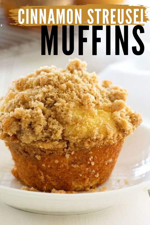 a close up of a muffin on a plate with the words cinnamon streusel muffins above it