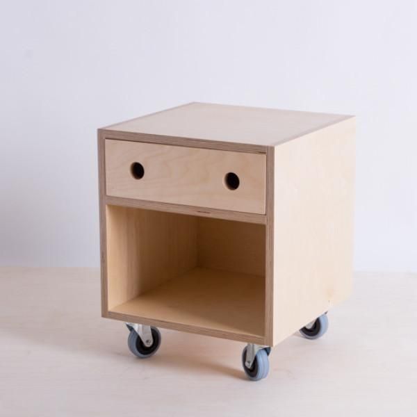 a small wooden table with two drawers on wheels