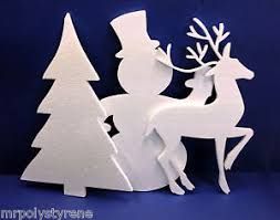 a white paper cut out of a deer and tree