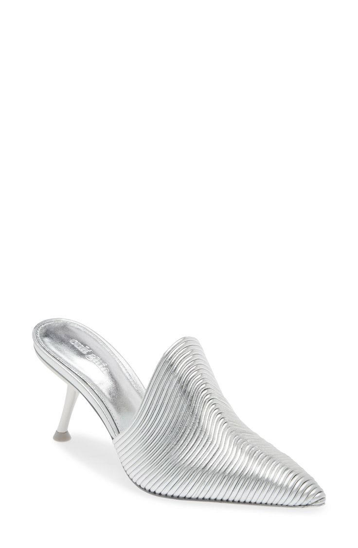 A textured leather upper with a shimmering metallic finish brings all the ultramodern vibes you want in this stylishly chic mule. 3" heel Leather upper and lining/rubber sole Made in Brazil Luxury Silver Mules With Sculpted Heel, Luxury Silver Mules For Party, Elegant Silver Open Heel Mules, Luxury Silver Mules With Padded Heel, Glamorous Leather Mules With Sculpted Heel, Luxury Metallic Mules For Party, Elegant Silver Mules For Party, Silver Mules With Sculpted Heel For Spring, Spring Silver Mules With Sculpted Heel