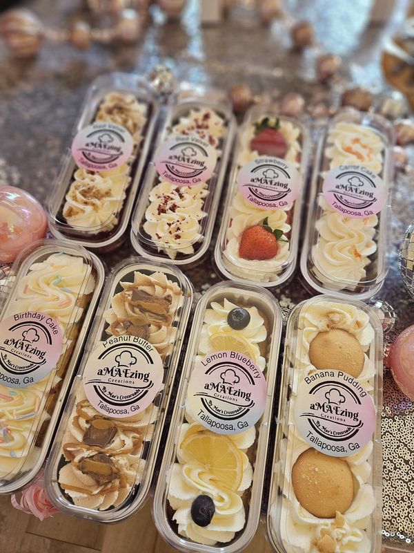 six plastic containers filled with different types of desserts and pastries on top of a table