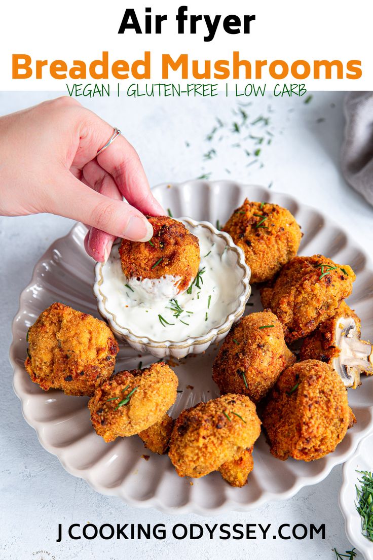 a person dipping some food into a bowl on a plate with the words, air fryer breaded mushrooms vegan gluten - free low carb