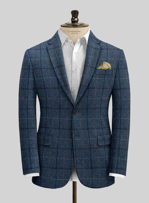 Channel boss vibes everyday with this refined Harris Tweed Gordon Blue Suit to look great in this new season. Crafted from pure wool, the suit is a stylish piece for your next elegant affair with a shade of blue that will help you charm your way through tedious tasks and an impeccable checks design that carries a timeless appeal. The suit will seamlessly blend together with your favorite shirt to create an eye catching ensemble.  Look Includes   Harris Tweed Gordon Blue Fabric  Two Button Jacket Style  Notch Lapel  Horn Royal Black Buttons  Single Vent  Three Cuff Buttons  Two Welted Back Pockets on Trousers   You can change the look during customization if required.  Lining: Viscose, Dry Clean. Luxury Tweed Blazer For Business Casual, Timeless Tweed Suit With Welt Pockets, Tweed Notch Lapel Suit For Business Casual, Business Casual Tweed Suits With Notch Lapel, Formal Tweed Suit With Suit Collar, Winter Office Tweed Suit, Timeless Tailored Blue Sport Coat, Single Breasted Tweed Suit For Work, Tailored Tweed Jacket For Business