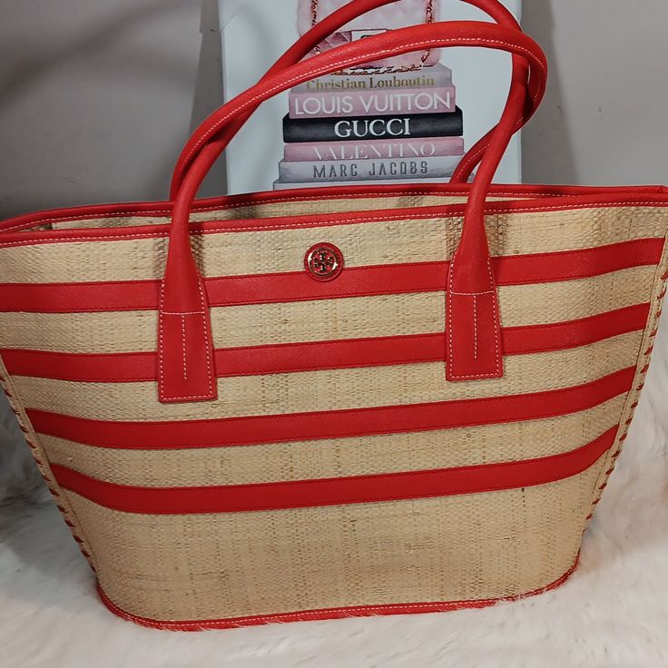 Tory Burch Straw Tote With Red Detailing Interior: Two Slip Pockets . Zip Top Closure. No Dust Bag Or Box. In Good Condition. Pre-Owned Red Tote Straw Bag For Shopping, Red Tote Straw Bag For Beach, Red Rectangular Straw Bag For Shopping, Tory Burch Red Bag, Tory Burch Bag Totes, Straw Tote, Tory Burch Bag, Womens Tote Bags, Tory Burch