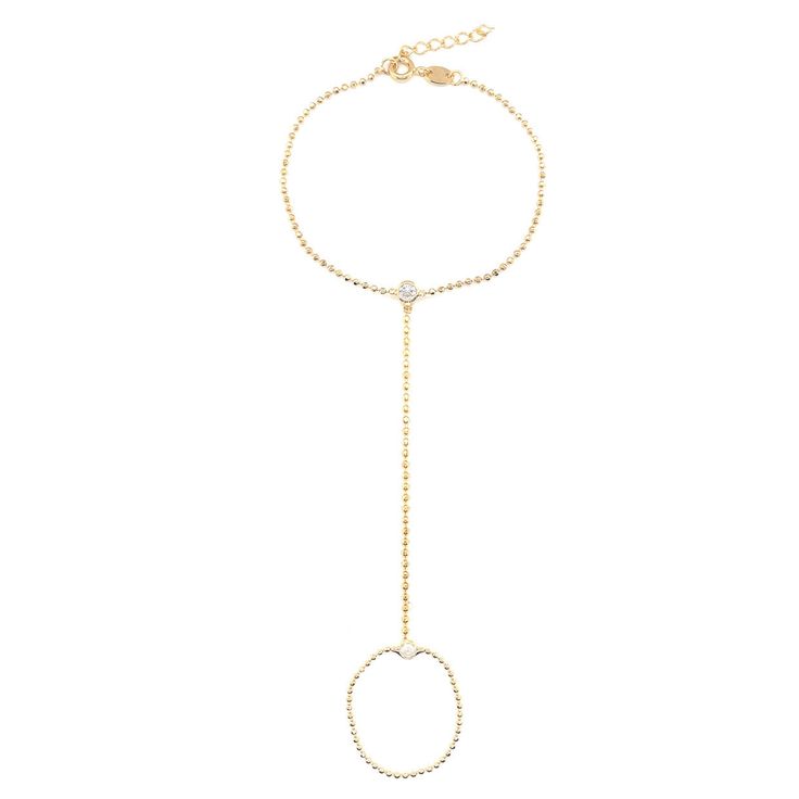 Our gold-filled hand chain bracelet is a striking piece of jewelry that combines elegance with a touch of whimsy. Its sleek and minimalist design adds a contemporary flair, making it a versatile accessory that can be worn for both casual and formal occasions. Bracelet Length: 6.5" + .5" Extension Finger Loop: 4" Elegant Gold-tone Chain Ring For Gift, Elegant Gold-tone Metal Chain Ring, Adjustable Minimalist Gold Chain Jewelry, Minimalist Adjustable Gold Chain Jewelry, Adjustable 14k Gold-filled Satellite Chain Bracelet, Adjustable 14k Gold-filled Chain Bracelet, Adjustable 14k Gold Filled Chain Bracelet, Elegant 14k Gold Filled Adjustable Chain Bracelet, Elegant Gold Chain Metal Ring