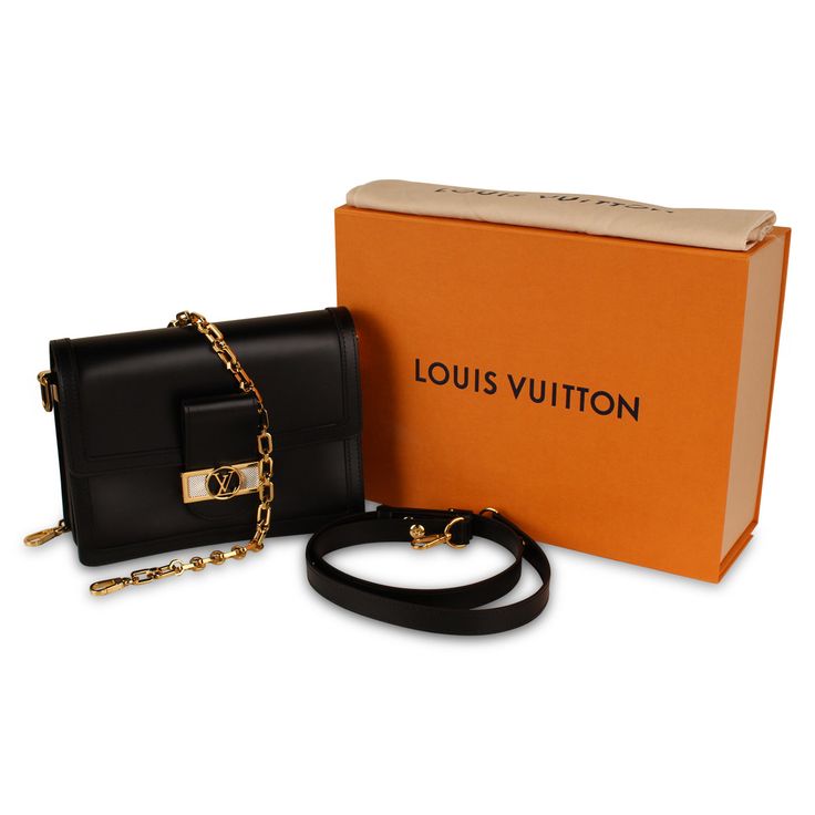 Designed by Nicolas Ghesquière, the 2019 cruise collection we have the Dauphine handbag. With Louis Vuitton’s contemporary theme it showcases a smooth black calfskin leather with gold hardware. With plenty of space to keep all of your essentials yet still remaining sleek and stylish. Practical yes effortlessly chic, the Dauphine is a well-worthy addition to any luxury handbag collection. SPL Exterior Smooth Black Calfskin Leather Black leather trim Front logo plaque with gold and silver Gold tone hardware Magnetic closure Single flap Removable chain strap and removable leather strap Excellent condition – minimal signs of use on exterior, some hairline scratches on front plaque Interior Black Suede Lining Two spacious compartments One zip compartment Slip pocket Louis Vuitton embossed leath Cruise Collection, Handbag Collection, Diaper Backpack, Casual Backpack, Leather Trim, Magnetic Closure, Luxury Handbags, Watch Design, Embossed Leather