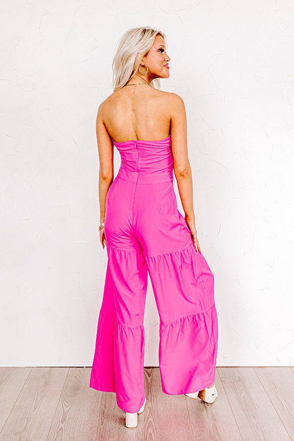 - All eyes will be on you when you step onto the scene in this must-have jumpsuit! - Lightweight, breezy material - A built in bodice lining as well as built in pants lining ending mid-thigh - Sweetheart neckline with a front twist detail - Back zip closure - A bodice with a trendy cutout detail - A relaxed silhouette that ends in wide floor length hemlines Pink Stretch Jumpsuit, Summer Pink Wide Leg Jumpsuits And Rompers, Pink Strapless Jumpsuits And Rompers For Party, Pink Wide Leg Jumpsuits And Rompers For Spring, Pink Strapless Jumpsuit For Summer Party, Pink Wide Leg Jumpsuits And Rompers For Summer, Pink Wide-leg Jumpsuits For Spring, Pink Stretch Jumpsuits And Rompers For Spring, Spring Party Pink Strapless Jumpsuit