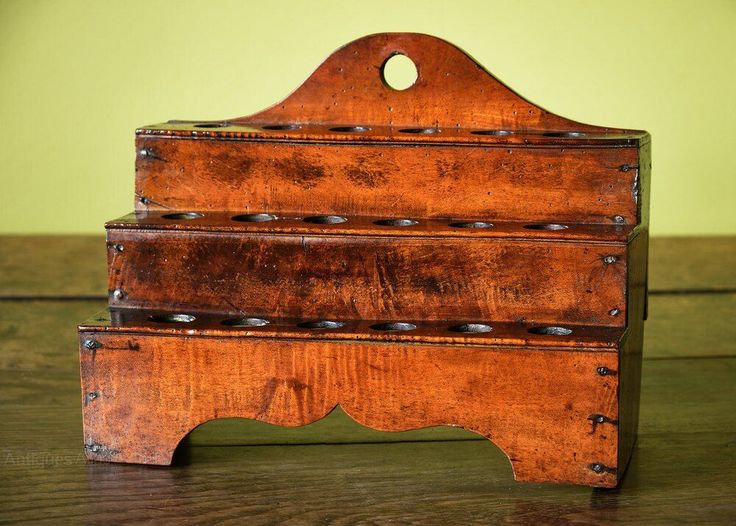 an old wooden box sitting on top of a table