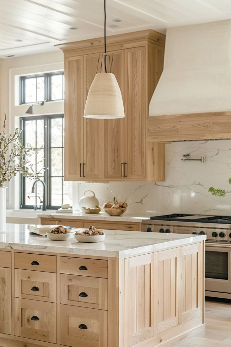 a kitchen with wooden cabinets and an island