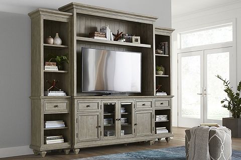 a living room with a large entertainment center