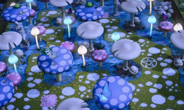 a table with blue mushrooms and candles on top of it in the shape of mushroom's