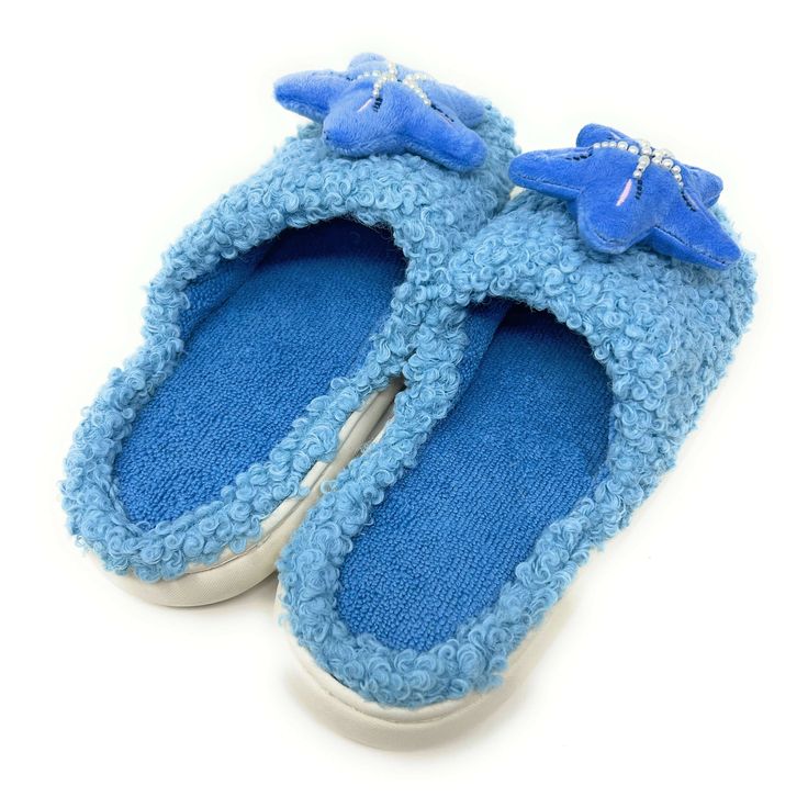 With their starfish motif and beachy vibes, these soft and cozy slides transport you to the tranquil shores with every step. Enjoy these super soft women's novelty slip-on slides from our partners at Oooh Geez! Slippers. Stay warm & look great with your new startfish themed blue fuzzy hard sole slides. Wear them around the house or out and about thanks to the non-skid rubber bottom. Pick up a pair today! Info Style: Sherpa slides with non-skid rubber bottom sole. Size: Small fits women's U.S. sh Comfortable Blue Slippers For Vacation, Comfortable Blue Beach Slippers, Comfortable Blue Slippers For Beach, Comfortable Blue Slippers For The Beach, Comfortable Indoor Slip-on Slides, Casual Slide Slippers Soft, Casual Soft Slide Slippers, Comfortable Soft Blue Slippers, Comfortable Vacation Slippers