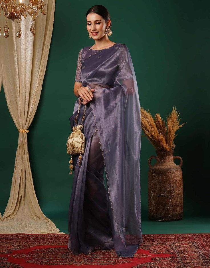 Mauve Embroidery Plain Net Saree  Mauve Embroidery Plain Net Saree is a delicate and feminine piece. The sheer net fabric drapes beautifully, creating a flowing and ethereal look. The plain net base provides a clean and minimalist backdrop for the intricate embroidery, which can feature floral motifs, geometric patterns, or abstract designs.  Features Of Mauve Embroidery Plain Net Saree  Traditional Handloom Craft  Intricate Gold Brocade Work  Durability and Longevity   Size Fit  The model heigh Plain Net Saree, Minimalist Backdrop, Saree Traditional, Gold Brocade, Navratri Special, Net Saree, Abstract Designs, Net Fabric, Intricate Embroidery