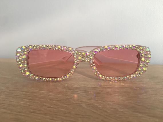 Pink square frames with ab crystals embellishing the entire front of the frames. Can be personalised. Party Sunglasses With Square Glass Frame, Rectangular Glass Sunglasses For Parties, Rectangular Tinted Sunglasses For Parties, Rectangular Glass Sunglasses For Party, Party Sunglasses With Square Frame And Mirrored Lenses, Party Sunglasses With Mirrored Lenses And Square Frame, Party Square Frame Sunglasses, Pink Square Frame Sunglasses For Party, Trendy Pink Square Frame Sunglasses