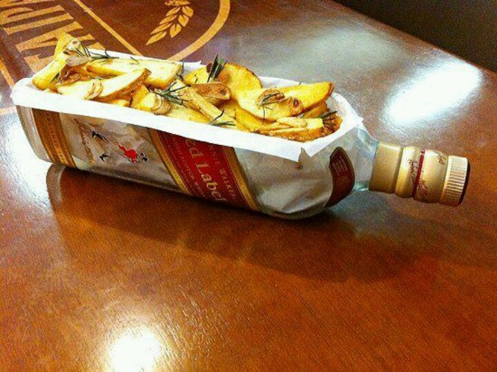 a container filled with food sitting on top of a wooden table