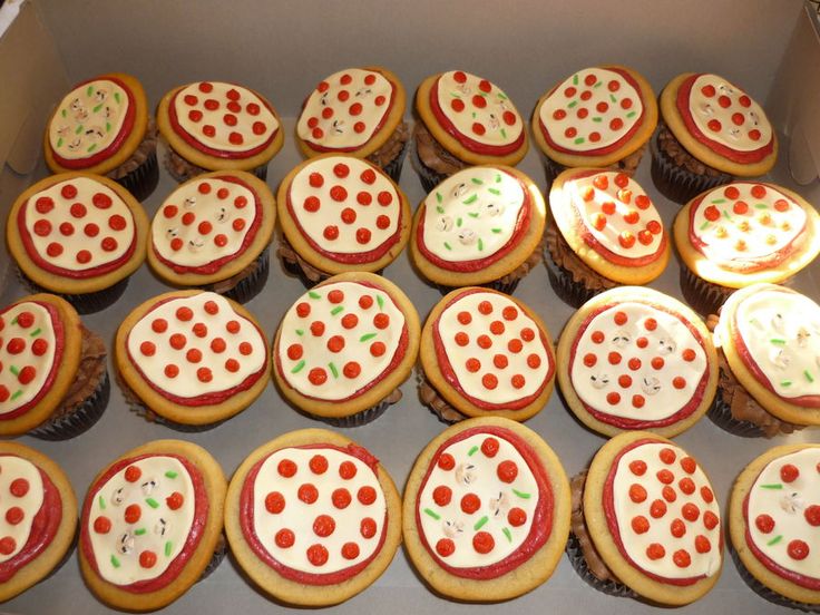 a box filled with lots of cupcakes covered in white frosting