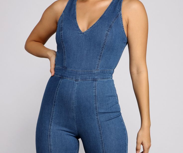 Showcase your fashion diva side in this trendy denim catsuit! It features a sleeveless bodice. tank straps. a V neck and back. and a back zipper closure. The high waist leads to form-fitting pant legs. offering a curve-hugging style. The denim fabric offers moderate stretch. Complete your look with a chic necklace and heels.Fit & Features Tank straps V neck and back Back zipper closure High waist Fitted pant legs Form-hugging fit Denim fabric with a moderate stretch Sleeveless Stretch Denim Jumpsuit In Medium Wash, Chic Sleeveless Dark Wash Denim Jumpsuit, Chic Dark Wash Sleeveless Denim Jumpsuit, Sleeveless Denim Blue Stretch Jumpsuit, Sleeveless Stretch Denim Blue Jumpsuits And Rompers, Chic Stretch Denim Blue Jumpsuit, Chic Stretch Denim Jumpsuit, Chic Stretch High Rise Denim Jumpsuit, Chic Stretch High-rise Denim Jumpsuit