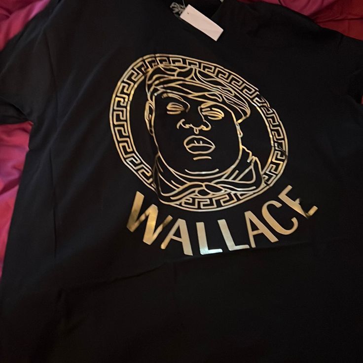 Get Your Fashion Notorious Biggie Wallace Shirt Comes In All Various Size Black Only With The Gold Tone. Trendy Gold Tops With Graphic Print, Gold Letter Print Top For Streetwear, Gold Tops With Logo Print For Streetwear, Gold Tops With Letter Print For Streetwear, Gold Casual Tops For Streetwear, Casual Gold Tops For Streetwear, Notorious Biggie, Lacoste Shirt, Hockey Shirts