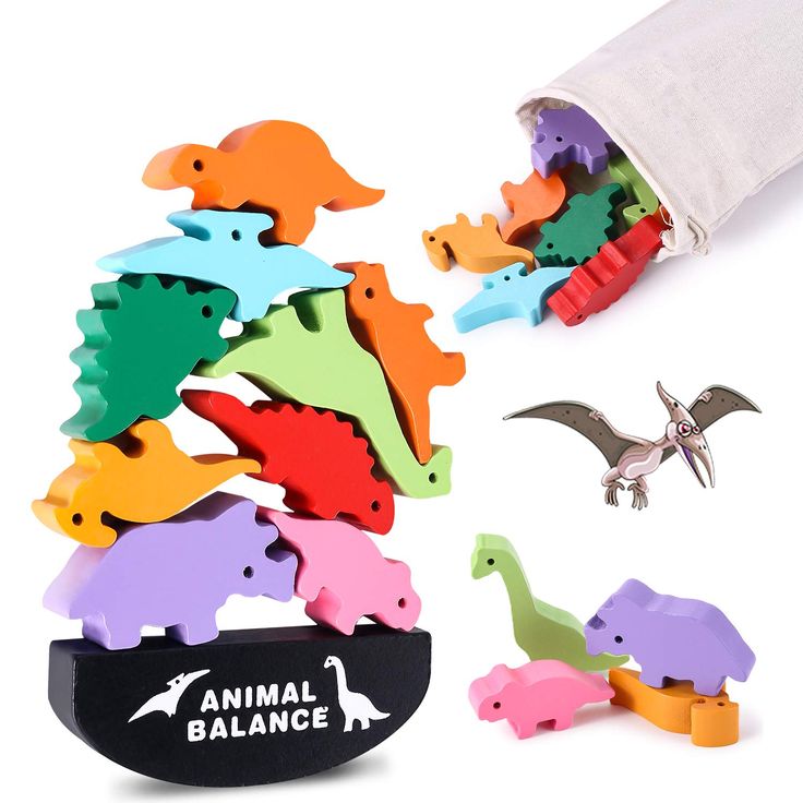 an animal balance game with dinosaurs and birds on it's back side, in front of a white background