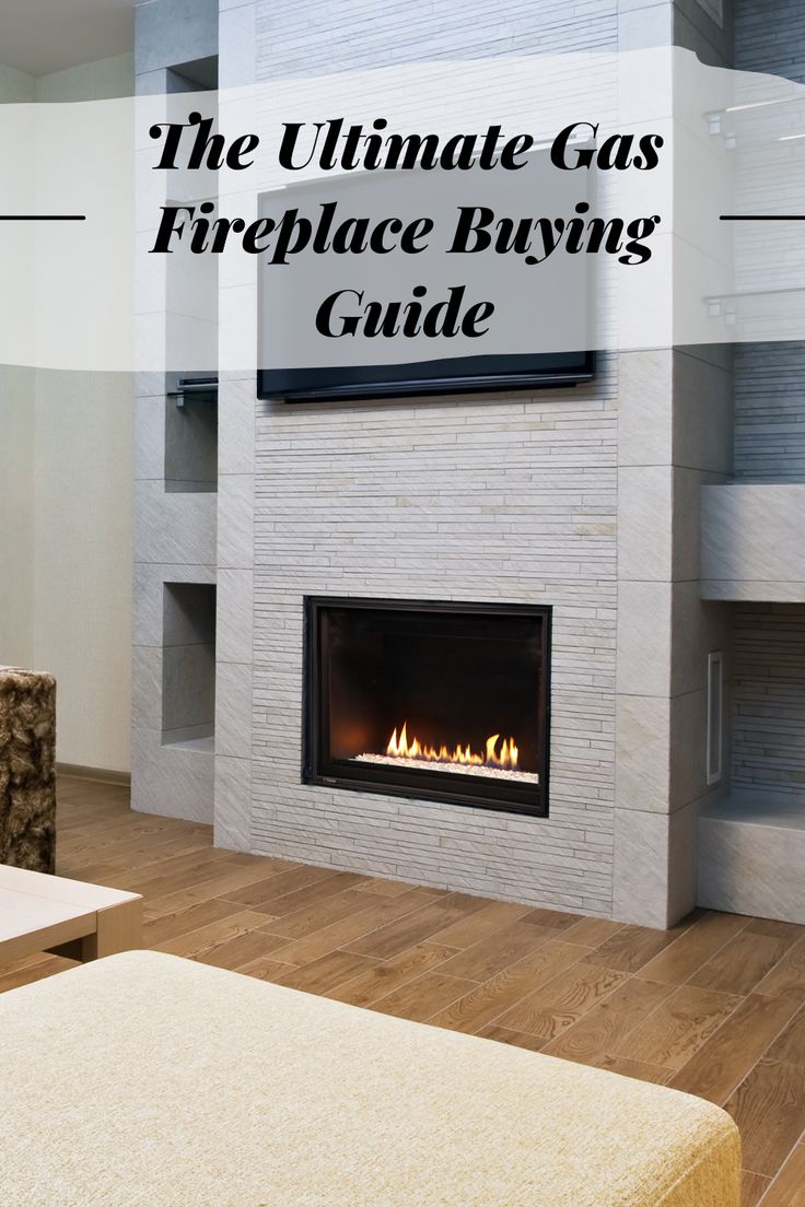 Modern gas fireplace embedded in a stone feature wall with the text "The Ultimate Gas Fireplace Buying Guide" displayed above. Simple Gas Fireplace Surround, Wall Gas Fireplace Ideas, Gas Fireplace With Bookshelves, Gas Fireplace No Hearth, Simple Gas Fireplace Ideas, Fireplace Inserts Gas, Ventless Gas Fireplace Ideas Built Ins, Indoor Gas Fireplace Ideas, Gas Insert Fireplace Ideas