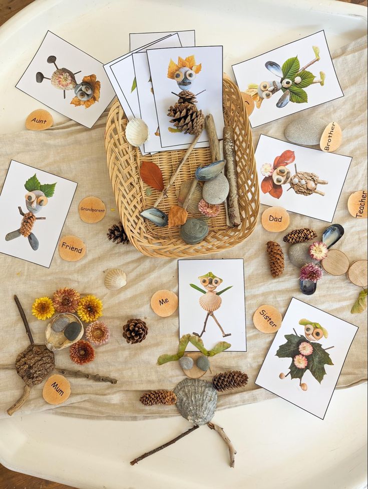 a basket filled with lots of cards and pine cones on top of a white plate