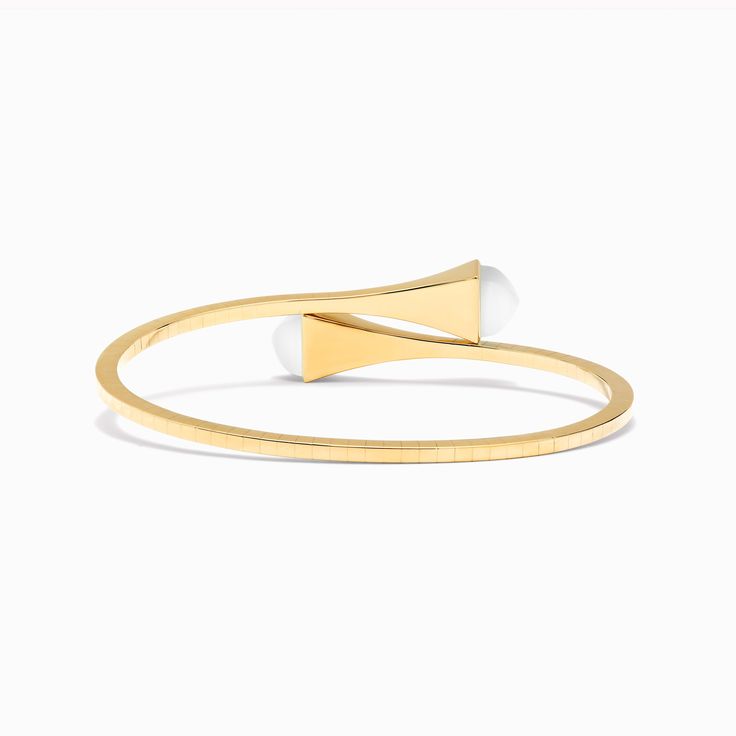 18 Karat Yellow Gold Slip-On Bracelet This distinctive design features a bracelet crafted from 18K white, rose, or yellow gold, and capped with precious gemstones of your choice for an iconic statement look. It can be worn alone or layered with other pieces of the collection for a fashion-forward look. Cleo by Marli draws inspiration from Cleopatra, evoking her strength and power capturing enriching color and daring design. Modern Gold Plated Jewelry With Bracelet Strap, Luxury Yellow Gold Cuff Bracelet With Oyster Clasp, Modern Bracelets For Anniversary, Modern Flexible Bracelets For Anniversary, Elegant 14k Gold Cuff Bracelet With Oyster Detail, Elegant 14k Gold Cuff Bracelet With Oyster Design, Modern Gold-plated Bracelets For Formal Occasions, Modern Yellow Gold Bracelet With Strap, Modern 14k Gold Bangle Bracelets