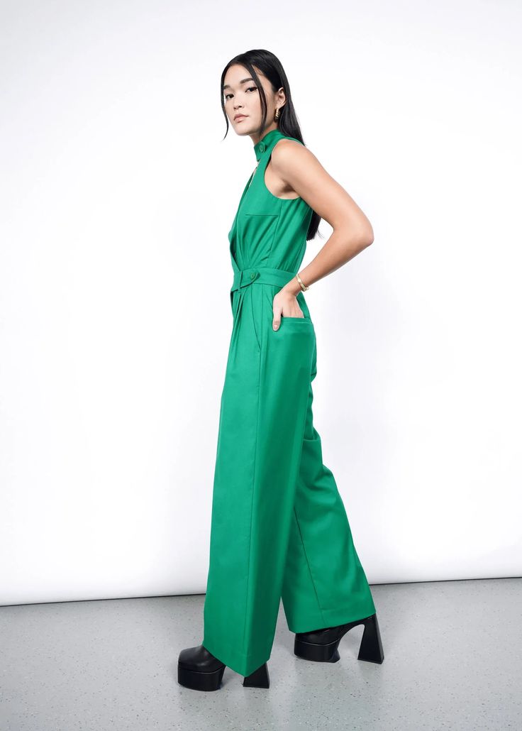 From day to night, from dinner to dancing, and from work to wedding - this jumpsuit can go anywhere. Featuring a tailored, high waisted fit and a high neck collar that can be unbuttoned for a more casual look, your dressed-up look is only a minute away with this one piece wonder. Fitted Belted Strapless Jumpsuit, High Neck Jumpsuits And Rompers For Summer, Belted Strapless Jumpsuit For Workwear, Chic Belted Strapless Jumpsuit For Work, Elegant Fitted High Neck Jumpsuit, Elegant Green Strapless Jumpsuit, Chic Belted Green Jumpsuits And Rompers, Chic Green Belted Jumpsuits And Rompers, Chic Green Belted Jumpsuit