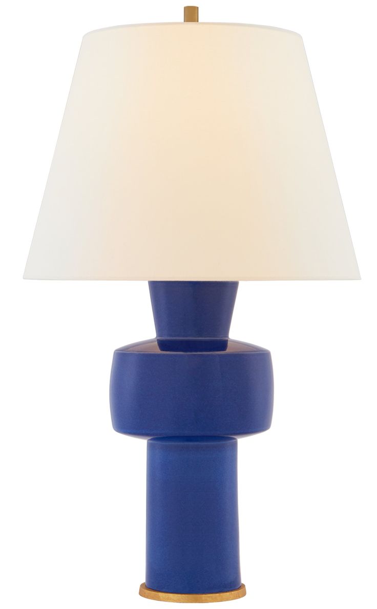 a blue lamp with a white shade on it