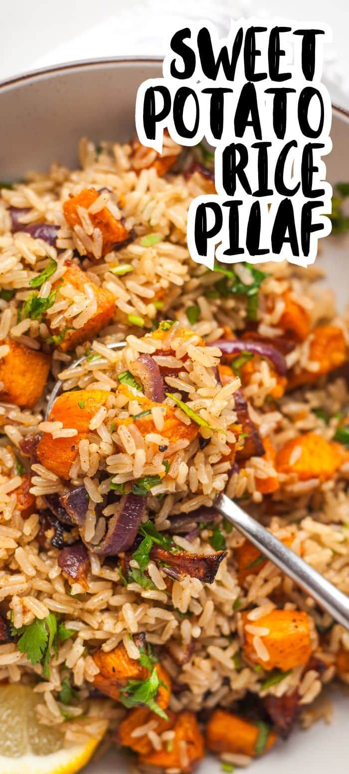 sweet potato rice pilaf in a bowl with lemon wedges