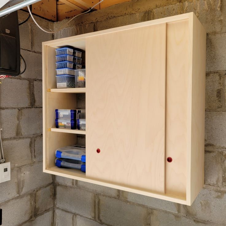 a bathroom with a sink, mirror and cabinets in it's wall niches