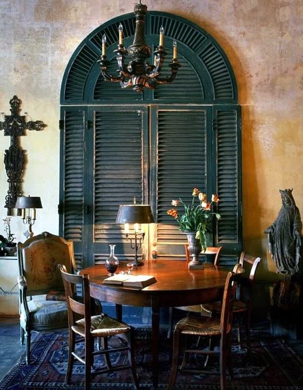 a dining room table with chairs and a chandelier