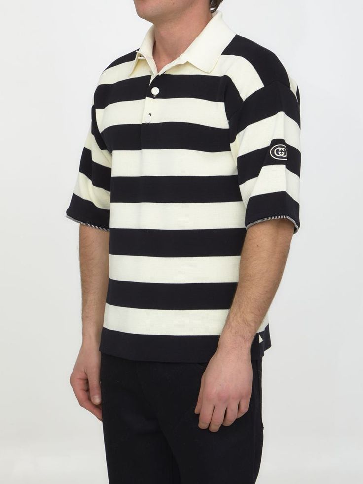 Ivory and black striped knit cotton polo with detachable zipped sleeves. It features pointed collar, front buttoned placket and GG patch on left sleeve. The model is 188cm tall and wears size M. Size nationality: INTGender: MenMaterial: 100% COTTONColor: BeigeMade in: ITProduct ID: 4273612 724708 XKCV0 9207*Import tax/duty will be calculated at checkout (If applicable) Casual Black Polo Sweater With Striped Collar, Classic Striped Polo Sweater With Ribbed Collar, Classic Striped Polo Sweater With Polo Collar, Classic Collared Polo Sweater With Contrast Stripes, Gucci Cotton Polo Shirt, Gucci Cotton Short Sleeve Polo Shirt, Gucci Casual Collared Polo Shirt, Casual Gucci Collared Polo Shirt, Casual Gucci Polo Shirt