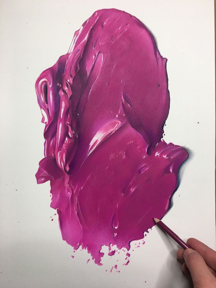 a person is holding a paintbrush in their left hand and painting on the paper