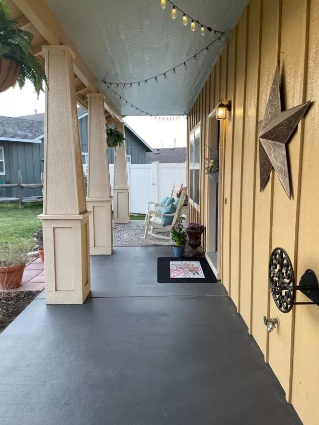 the front porch is decorated with stars and lights