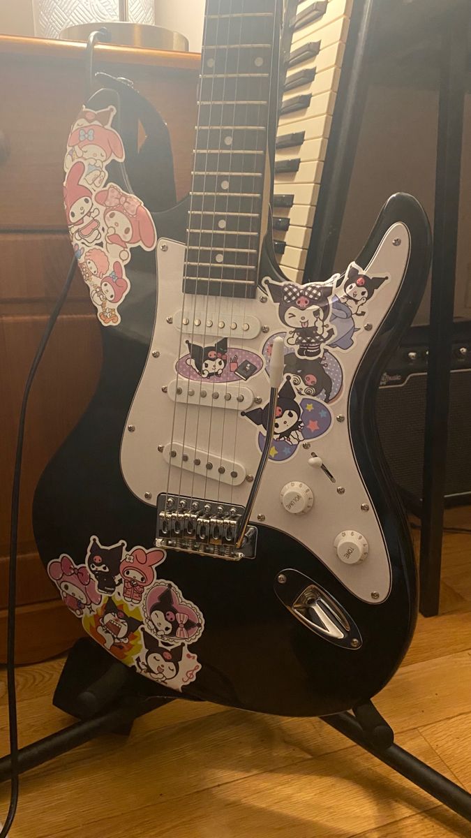 an electric guitar sitting on top of a wooden floor