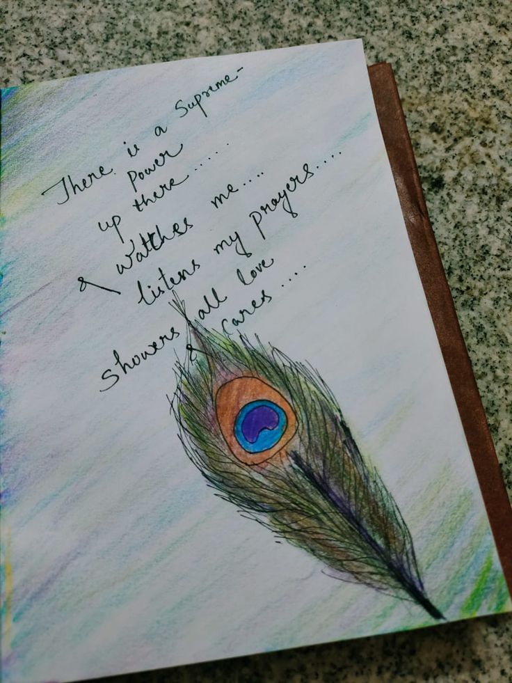 a piece of paper with a drawing of a peacock's feather on it that says, there is a surprise up there