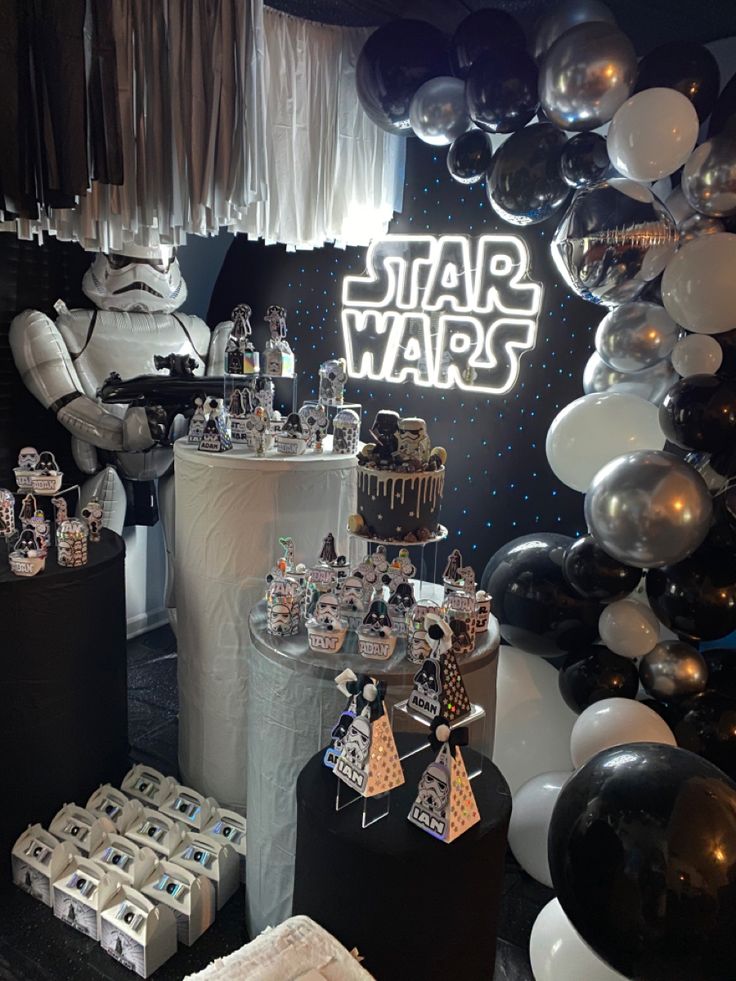 a star wars themed birthday party with balloons and decorations