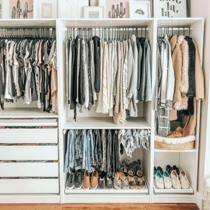 a white closet filled with lots of clothes and shoes