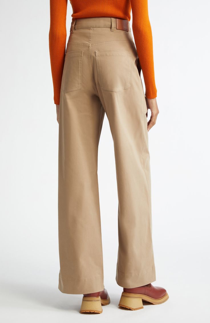 Crafted in a high-waist, wide-leg silhouette, these season-spanning pants are cut from cotton gabardine with a hint of stretch for easy-moving comfort. Zip fly with button closure Front patch pockets; back patch pockets 98% cotton, 2% elastane Machine wash, line dry Imported Designer Clothing Beige Wide Leg Cargo Pants With Five Pockets, Beige Wide Leg Pants With Five Pockets, Cotton Wide Leg Work Pants, Wide Leg Cotton Work Pants, Beige Wide-leg Pants With Five Pockets, Beige Wide Leg Pants With Five Pockets For Work, Fall Cotton Wide Leg Pants With Five Pockets, Cotton Wide-leg Work Pants, Cotton Wide Leg Pants With Belt Loops For Fall