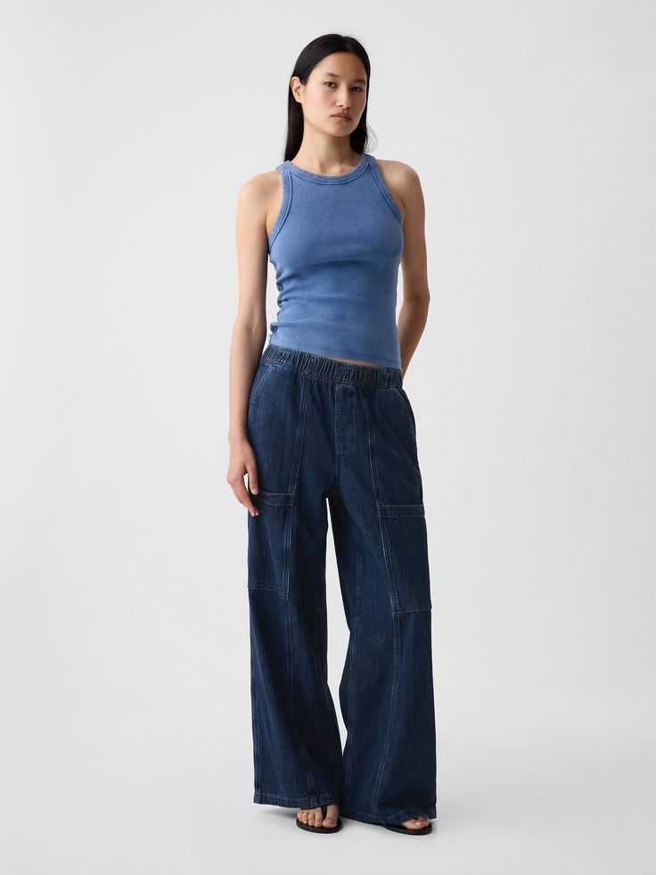 Fit: A full-length high rise jean that's loose throughout.  Finishes with a relaxed wide leg.  Fabric: 95% Cotton, 5% Recycled Cotton.  Stretch: No Stretch Jeans.  Authentic denim that gets better with every wear.  Made to wear all day & break in over time. ​ Rise: High Rise Skirt.  Look: A loose wide-leg utility jean in a dark indigo wash.  Details: Elasticized waist, front slant pockets, side cargo pockets, & back patch pockets.  Responsibly Made: This pair of jeans is part of our water-saving High Rise Skirt, Streetwear Accessories, Loose Fit Jeans, Gap Pants, Break In, Gap Jeans, Denim Outfit, Recycled Cotton, Stretch Jeans