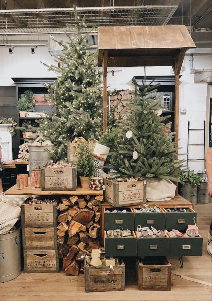 a christmas tree is surrounded by boxes and other items